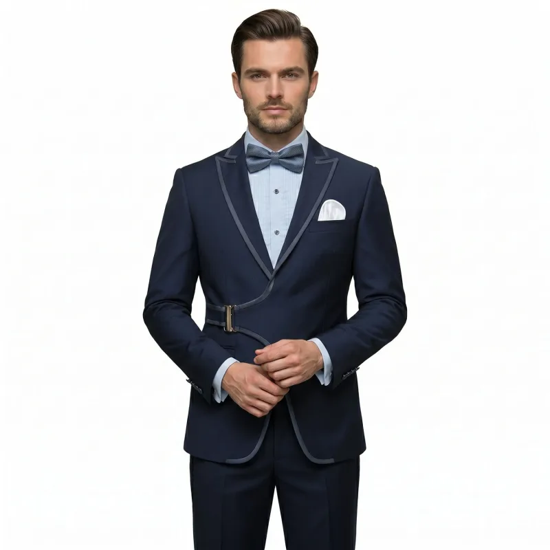 Men’s black tuxedo with satin piping, buckle detail, matching trousers, dress shirt, bow tie, and pocket square by Andre Emilio